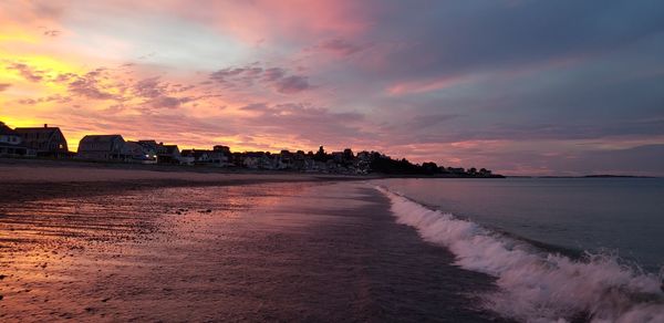 Scenic view of beach against sky during sunset