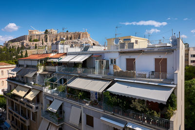 Low angle view of buildings against blue sky