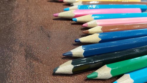 Close-up of colored pencils on table