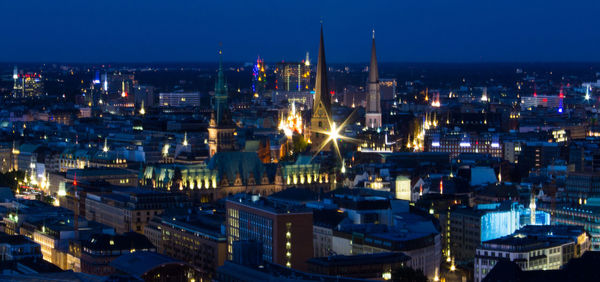 Illuminated cityscape at night