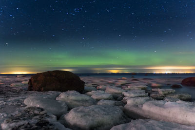 Scenic view of sea against sky at night