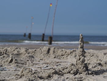 Scenic view of beach against clear sky