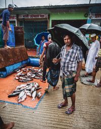 Women standing at market stall