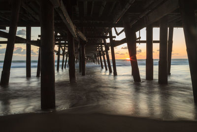 Low angle view of bridge at calm sea