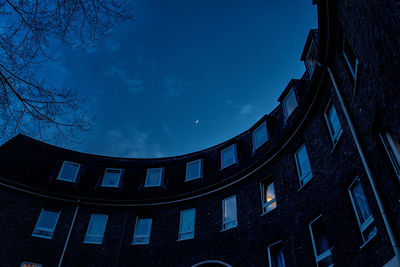 Low angle view of building against blue sky