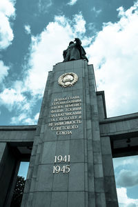 Low angle view of clock tower against sky