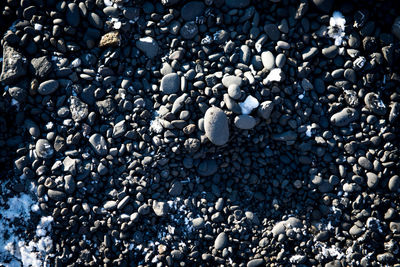 High angle view of stones on pebbles