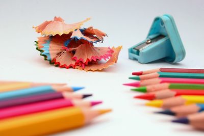 Close-up of multi colored pencils on table