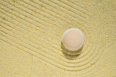 High angle view of drink on sand