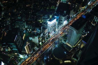 High angle view of illuminated buildings in city at night