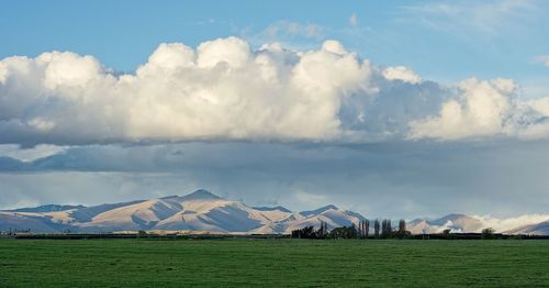 Scenic view of hawkdun range against cloudy sky