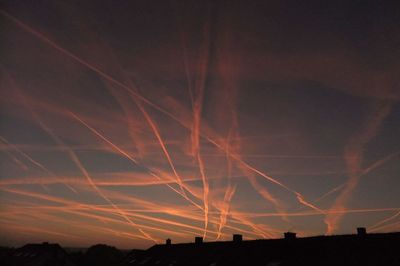 Silhouette landscape against sky at night