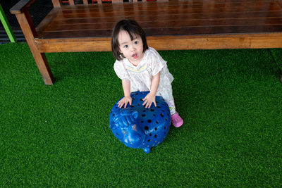 High angle portrait of girl on turf