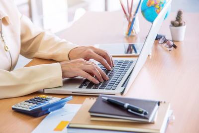 Man using laptop on table