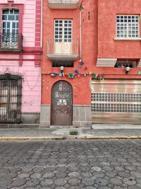 Footpath by building in city