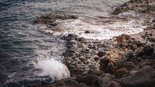 Waves splashing on rocks