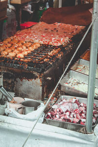 Cropped hand of man preparing food at concession stand