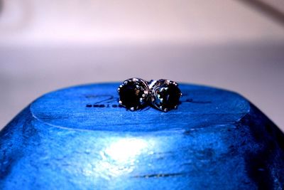 Macro shot of wedding rings on blue ring