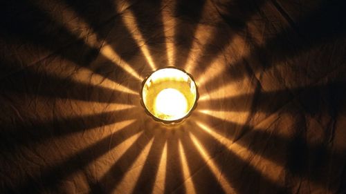 Low angle view of illuminated light bulb