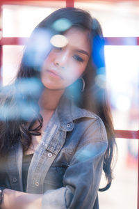 Portrait of young woman looking away