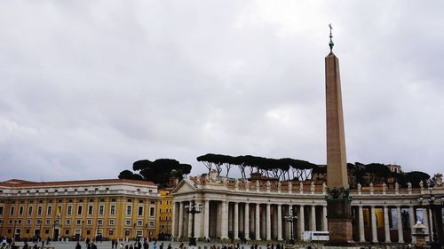 Low angle view of building against cloudy sky