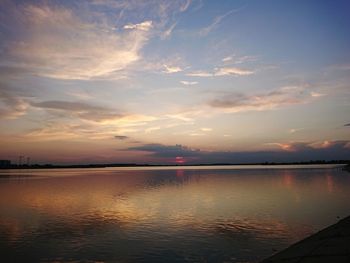 Scenic view of lake against sky during sunset