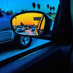 Car on road at sunset