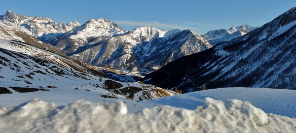 Scenic view of snowcapped mountains against sky