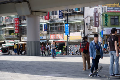 Group of people walking in city