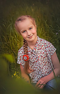 Portrait of a smiling girl in field