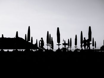 Silhouette of flags at dusk