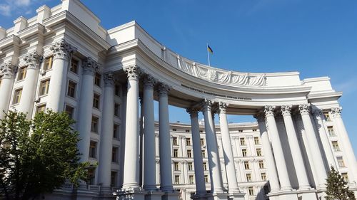 Low angle view of building against blue sky