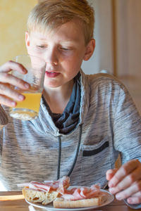 Close-up of a teenage boy at breakfast