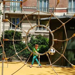 Boy playing on slide at playground