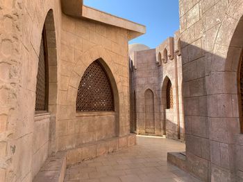 Empty footpath by historical buildings