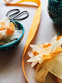High angle view of orange flower on table