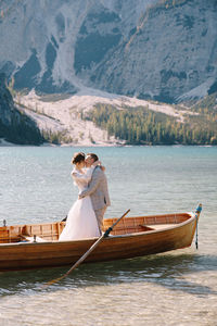 Young couple in boat at lake