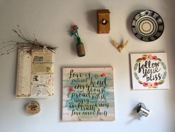 Close-up of text on paper hanging on table