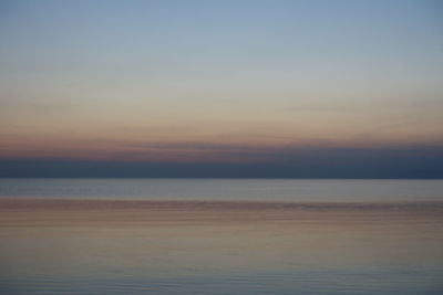 Scenic view of sea against sky at sunset