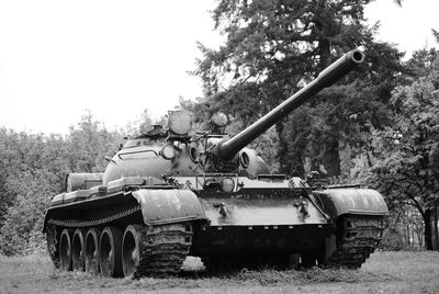 Armored tank on field against clear sky