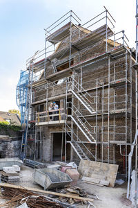 Expertise team working while standing in balcony at construction site