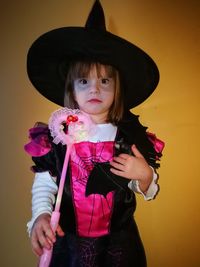 Portrait of girl wearing hat at home