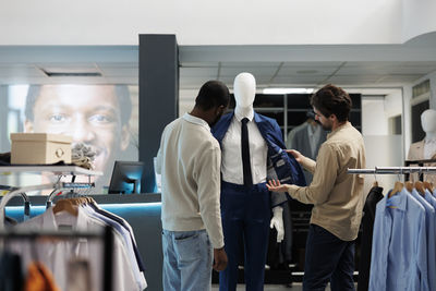 Rear view of man working in office