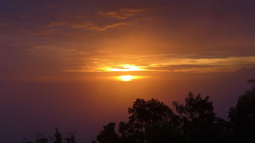 Scenic view of dramatic sky during sunset