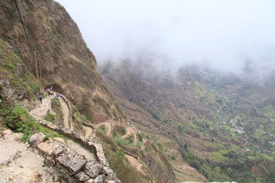 Scenic view of mountains against sky during foggy weather