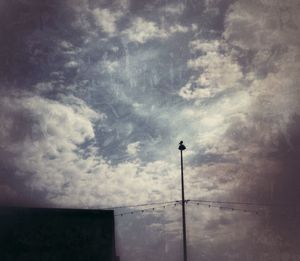 Low angle view of street light against sky