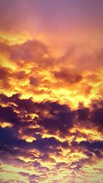 Low angle view of dramatic sky during sunset