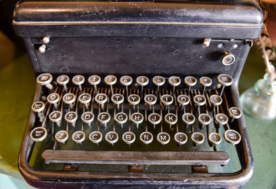 Close-up of old machine part on table