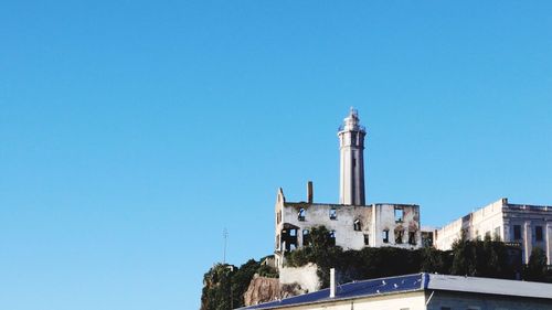 Low angle view of built structure against blue sky