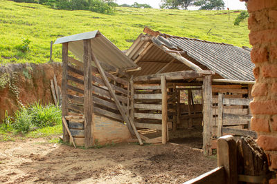 Wooden hut on field